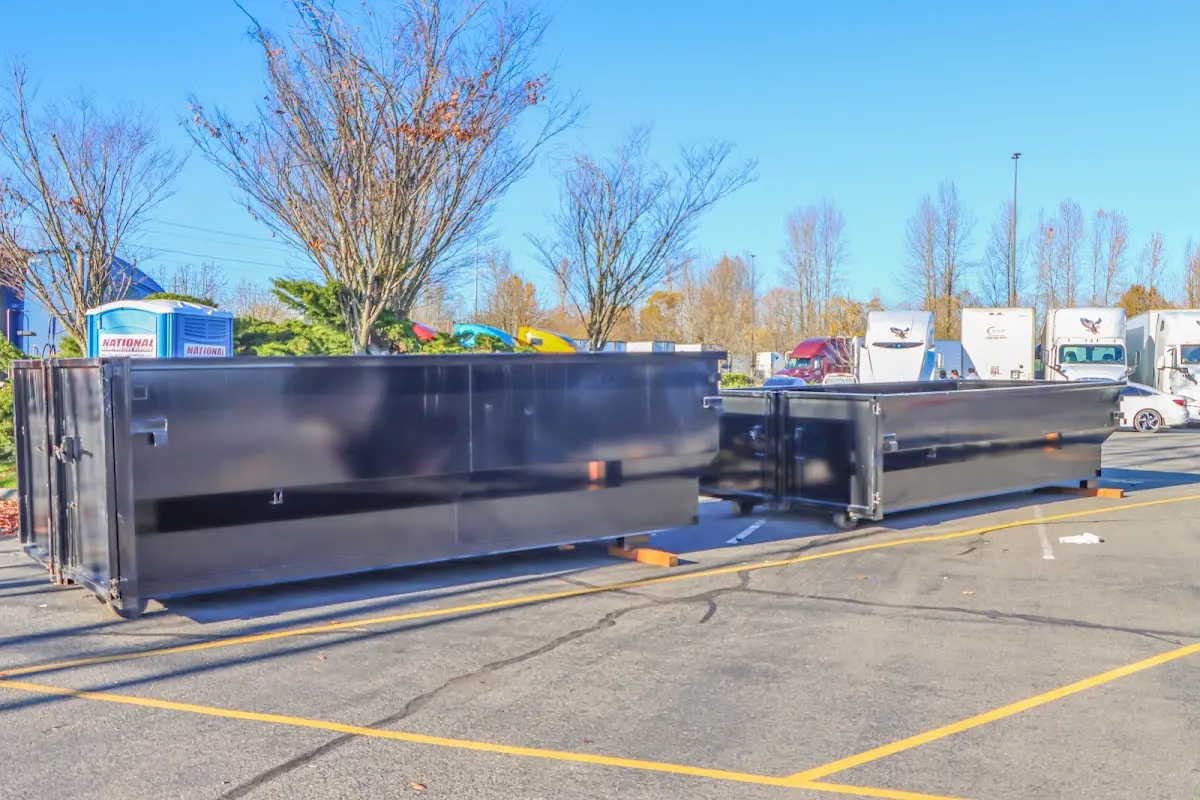 Professional dumpster rental service with roll-off container on residential driveway in Glenarden